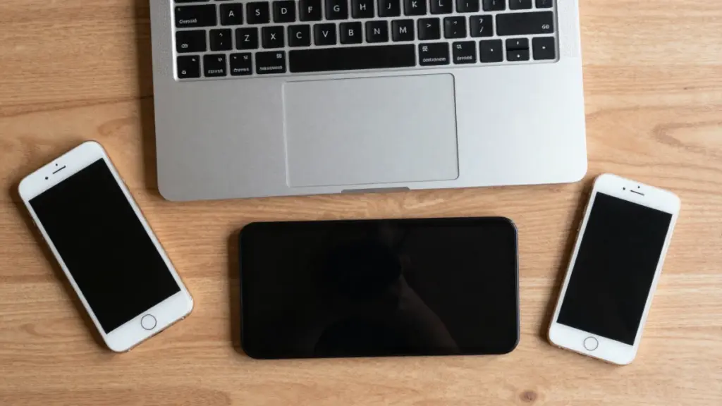 The Smart Buyer’s Guide to Used Tech: What I’ve Learned From a Decade of Testing Devices Clean flat-lay of used tech devices on a desk for a tech buying guide.
